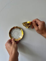Vintage-Set aus goldener Espressotasse und Untertasse – zwei Sammlerstücke
